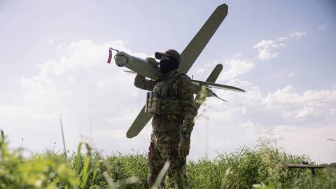 Ukrainian soldier with an autonomous drone.